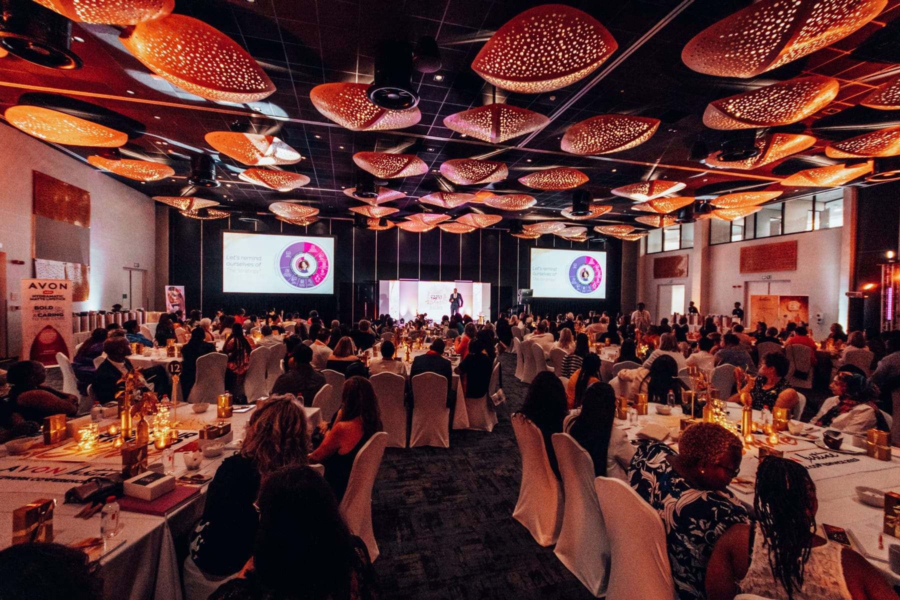 The full AVON ballroom with screens either side of the stage