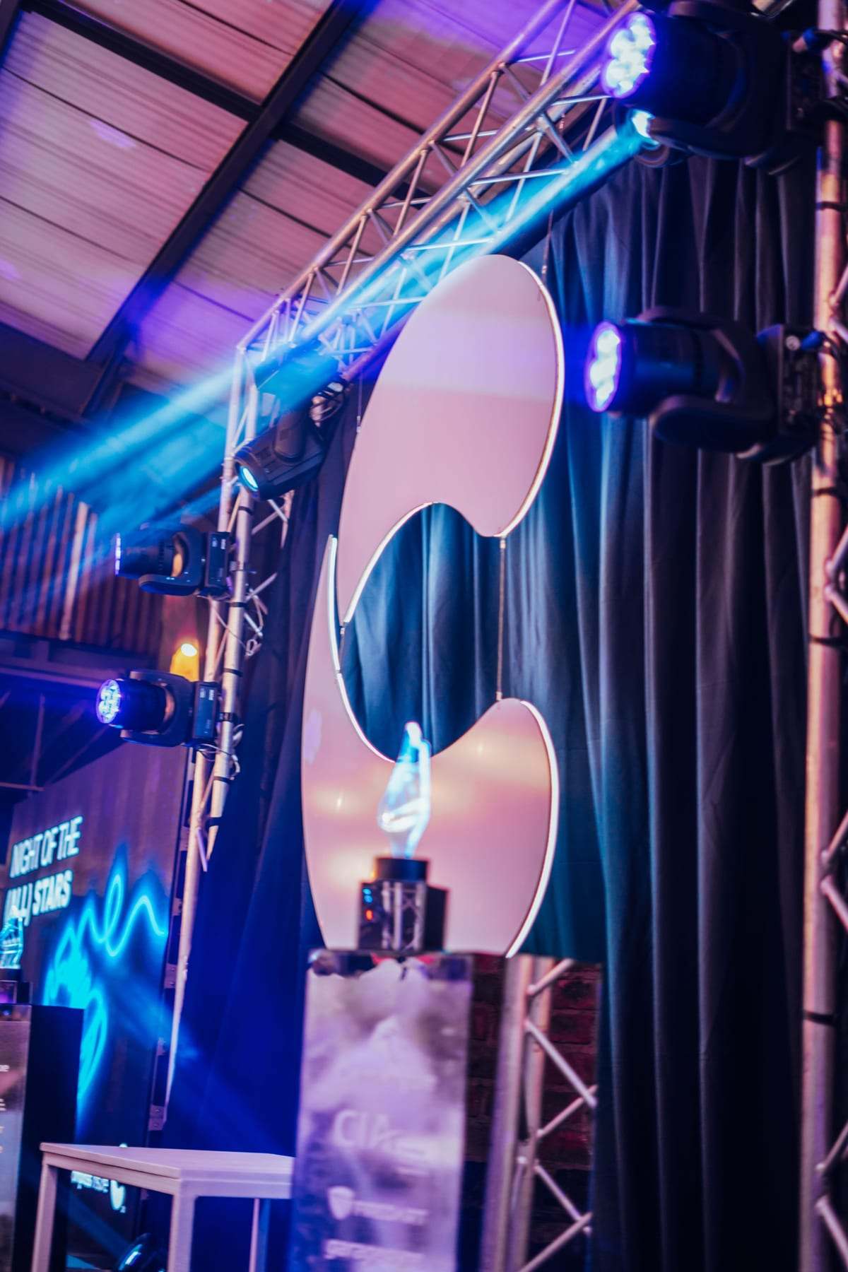 The Compass logo on the truss frame lit blue