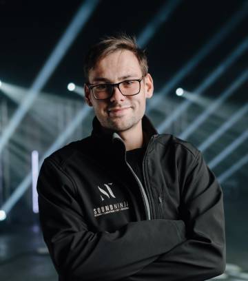 A member of the Sound Ninja crew in a branded jacket