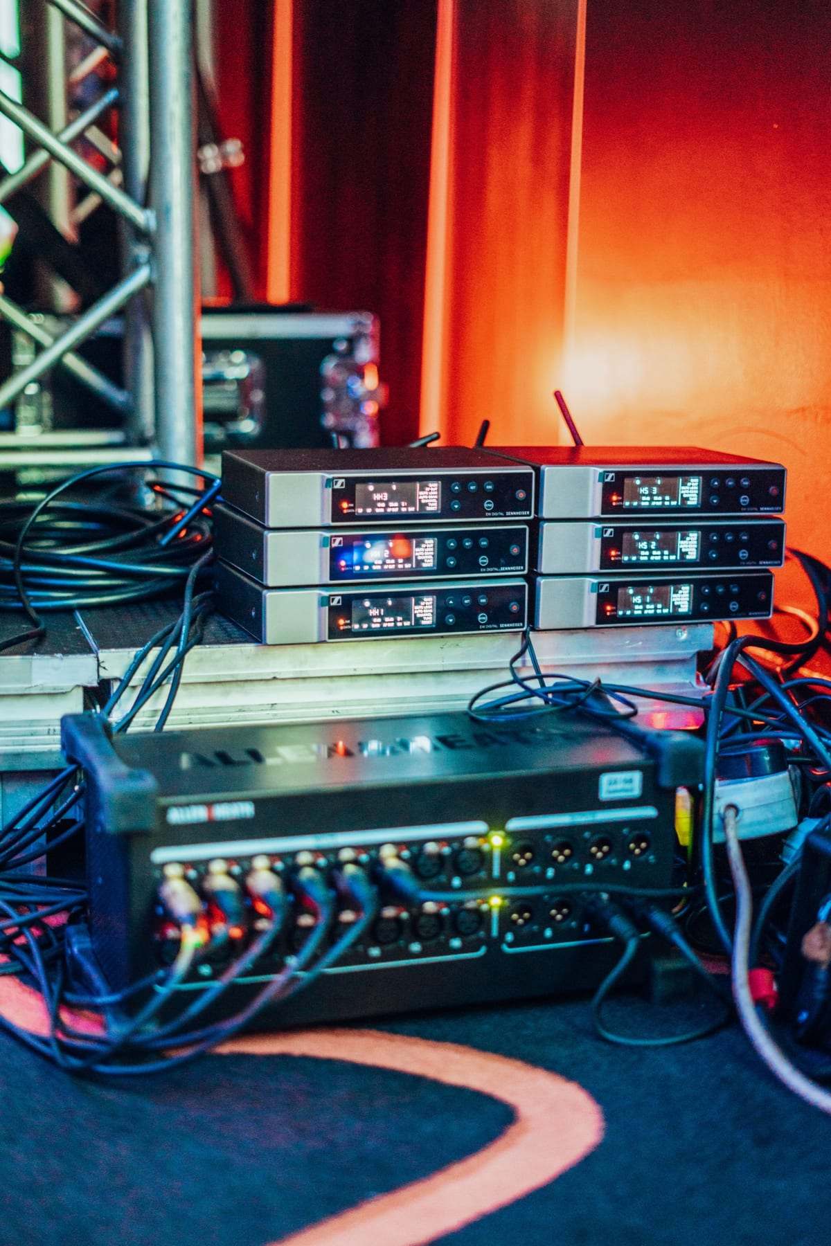 A rack of wireless microphone receivers on the truss