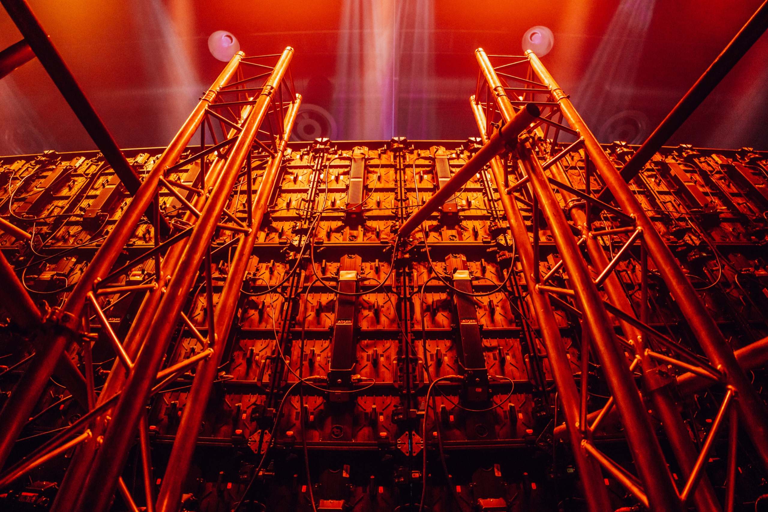 Truss and LED panels lit red behind the stage at the SAICA gala