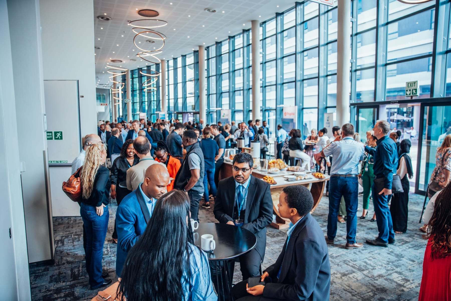 Delegates networking in the foyer between sessions